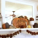 fall mantel with pinecones