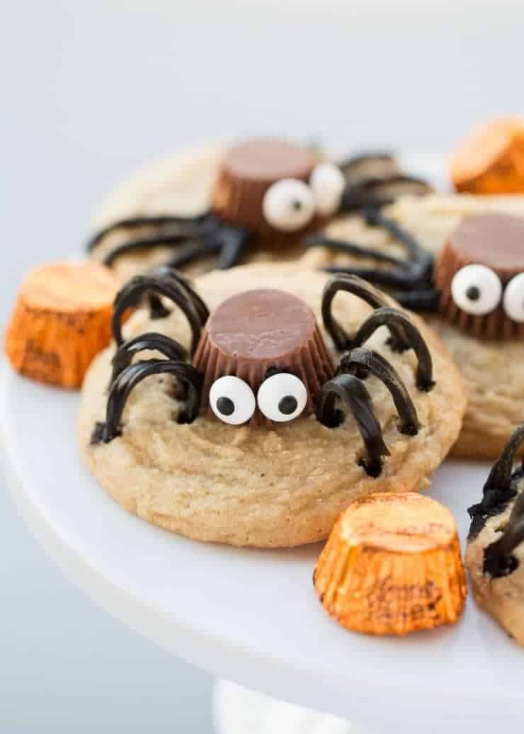 Spider Cookies made with a REESE'S Peanut Butter Cups Miniatures, candy eyes and TWIZZLERS Twists. These are the perfect Halloween cookie for kids and adults!