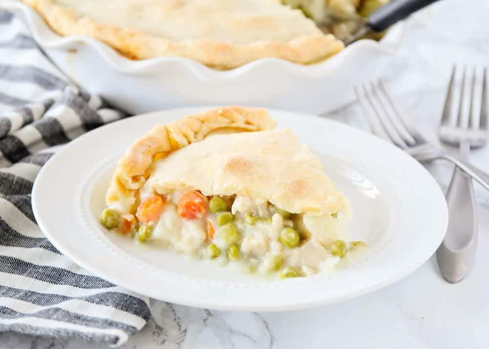 Piece of homemade chicken pot pie on a white plate.