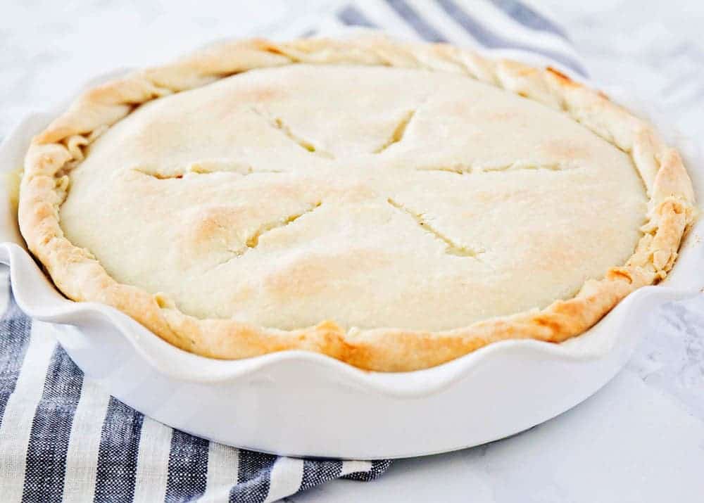 Whole homemade pot pie in a pie dish.