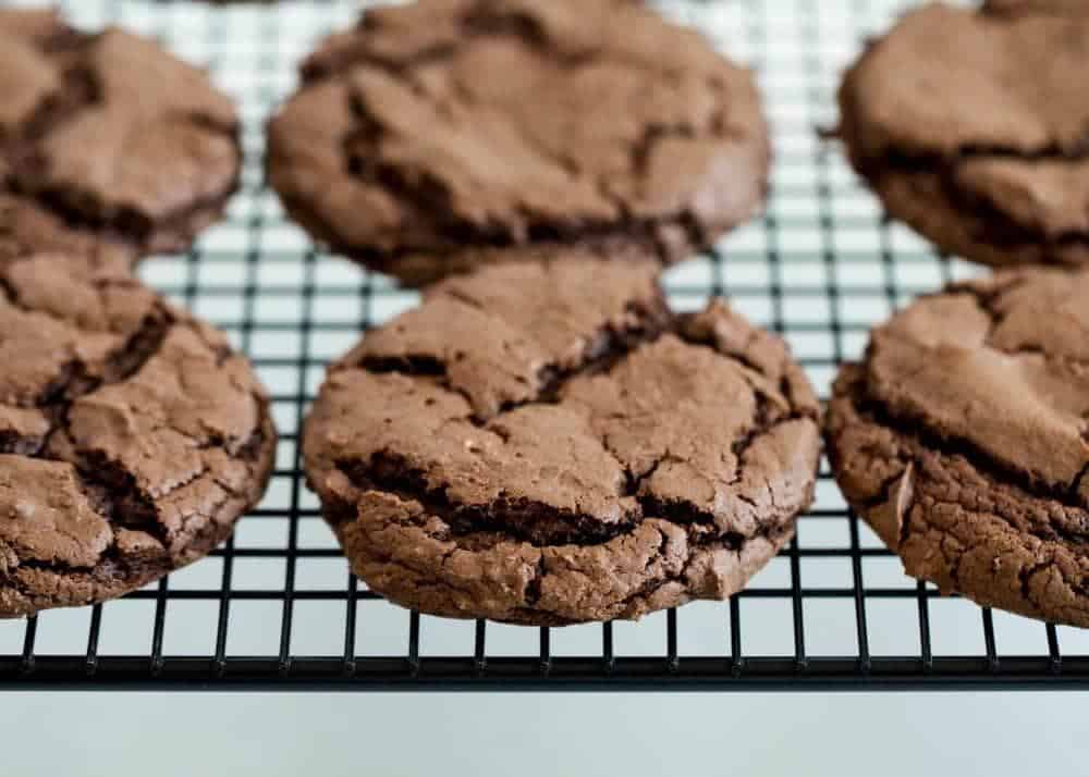 Homemade Oreo cookies on cooling rack.
