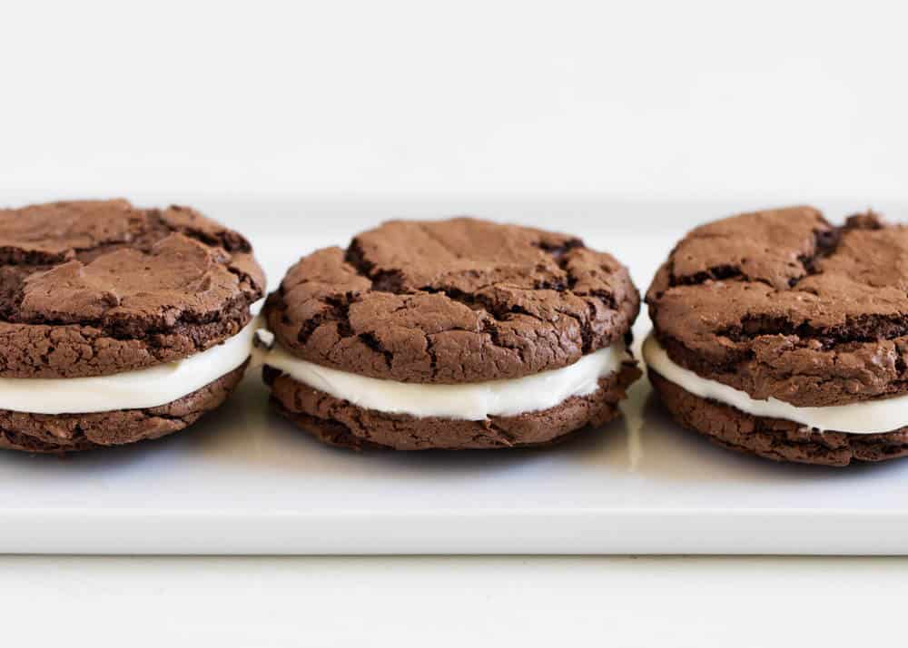 Homemade Oreos lined on plate.