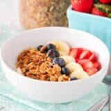 granola in a bowl with fresh fruit