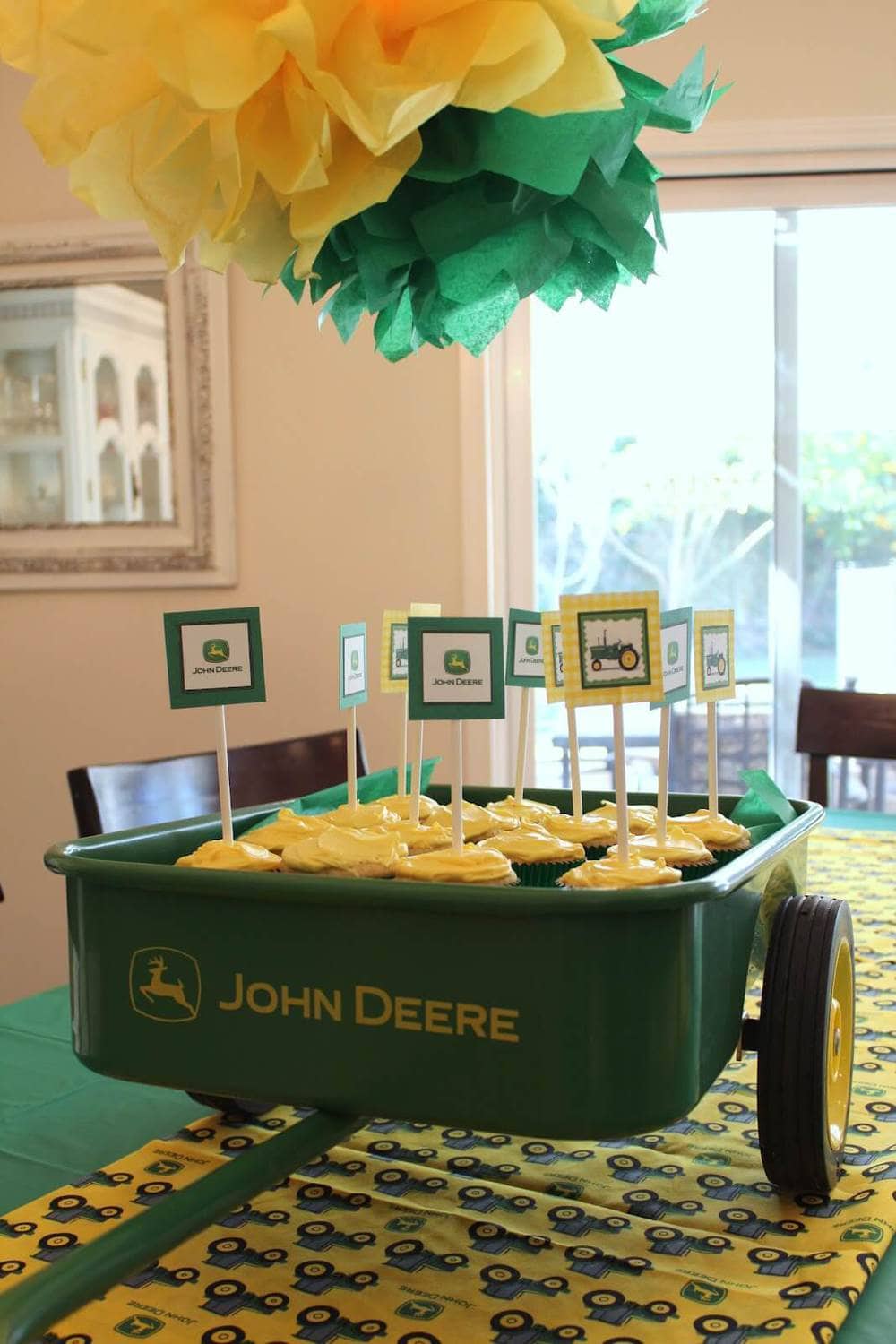 green and yellow john deere decorated cupcakes with cupcake toppers 