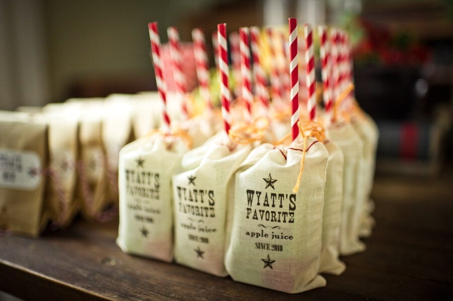 cowboy birthday party favors on wood table 