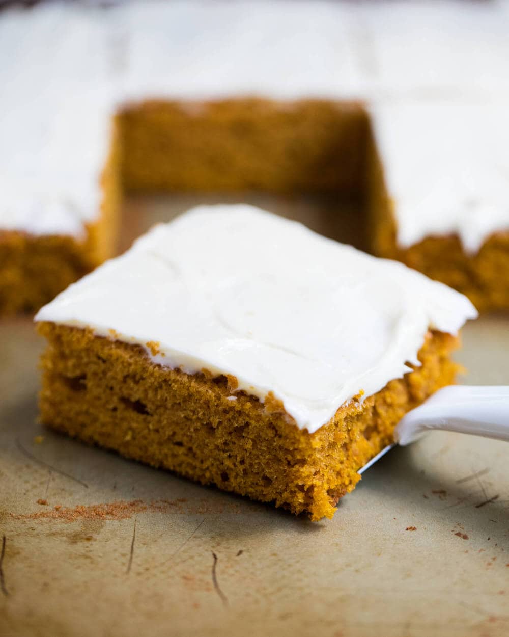 Pumpkin bar with cream cheese frosting.