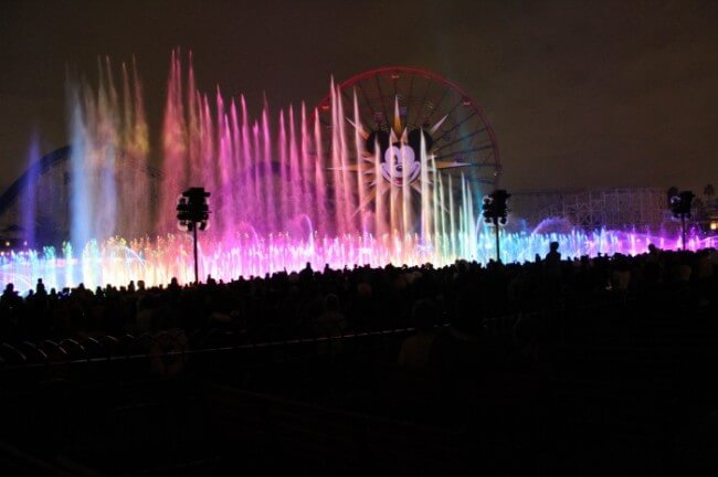 rainbow colored water fountains shooting into air 