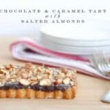 caramel chocolate almond tart on wood table