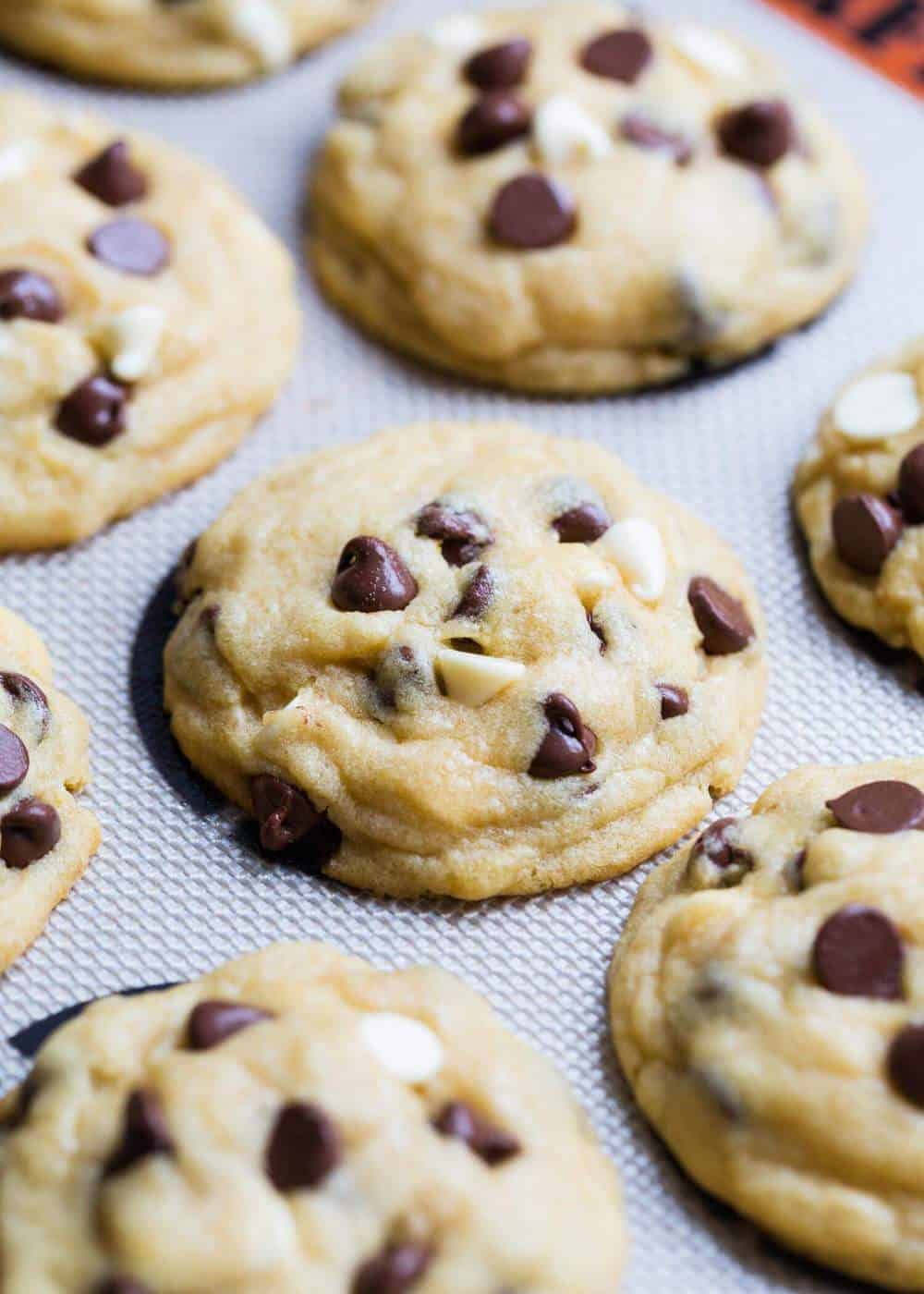 Chocolate chip pudding cookies on a Silpat mat.