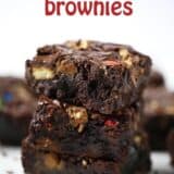a stack of loaded candy bar brownies