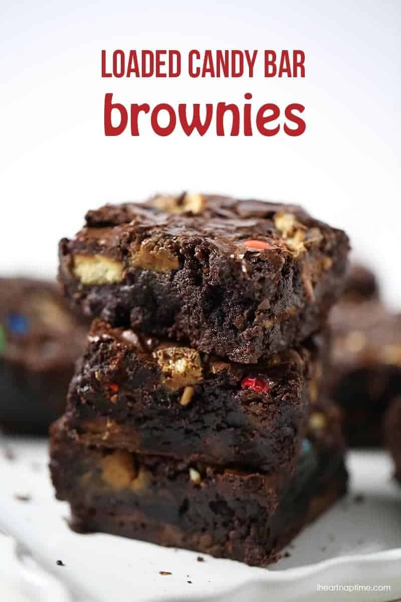 a stack of loaded candy bar brownies 