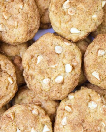 A close up of pumpkin snickerdoodle cookies with white chocolate chips
