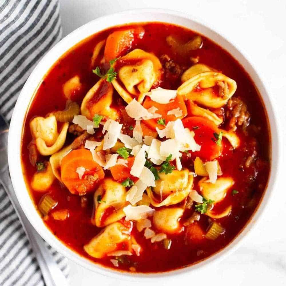 Bowl of sausage tortellini soup.