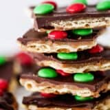 a close up of a stack of christmas crack toffee