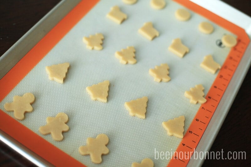 christmas sugar cookie cut outs on baking sheet 