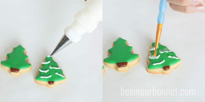 piping frosting on top of christmas sugar cookies 