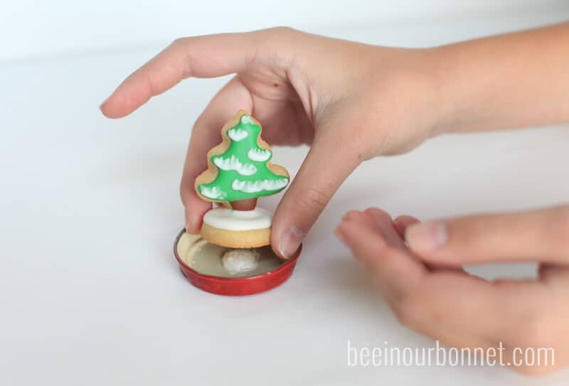 assembling sugar cookie snow globes 