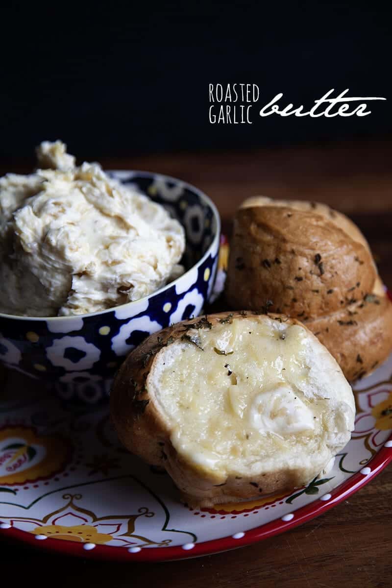 Roasted garlic compound butter on a piece of bread.