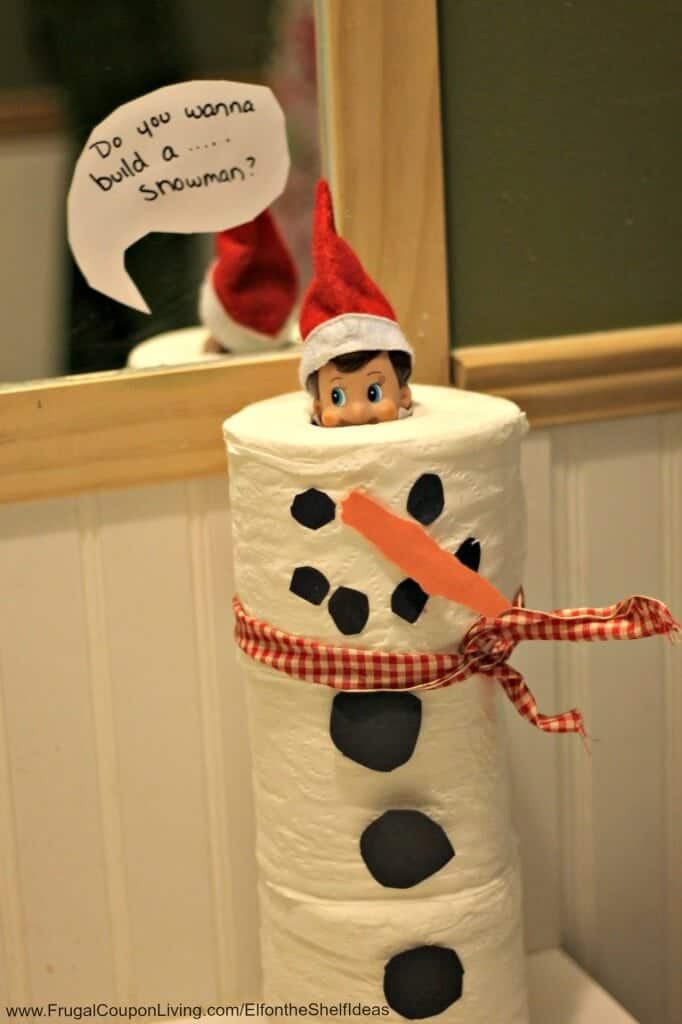 Elf building a toilet paper snowman.
