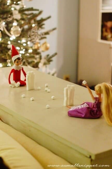 Top 50 of the BEST Elf on the Shelf ideas - So many fun ideas to do with your Elf leading up to Christmas! Your family will love these list amazing list of elf ideas! Elf having a snowball fight indoors