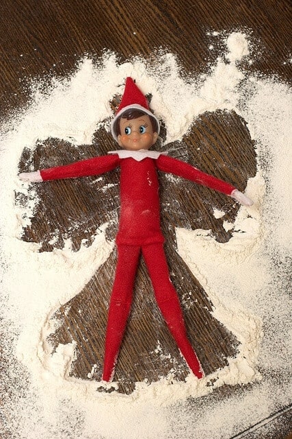 Elf making snow angels