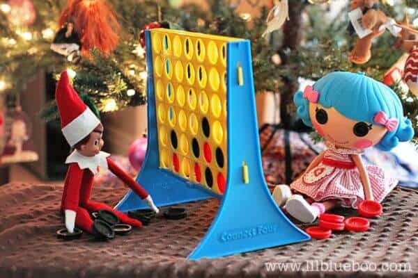 Top 50 of the BEST Elf on the Shelf ideas - So many fun ideas to do with your Elf leading up to Christmas! Your family will love these list amazing list of elf ideas! Elf playing connect four