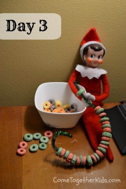 Elf making fruit loop chains.