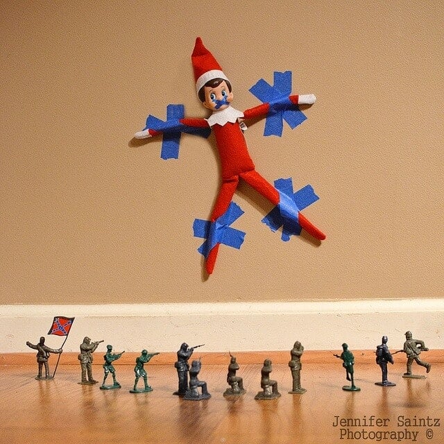 Elf taped to the wall.