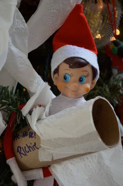 Elf toilet papering the tree.