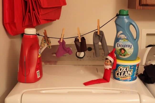 Elf hanging laundry.