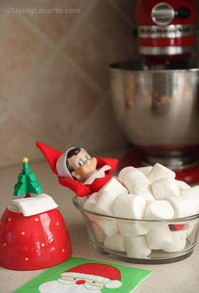 Elf taking a bath in marshmallows