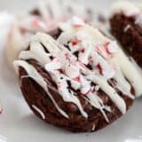 A close up of a peppermint oreo brownie drizzled in white chocolate