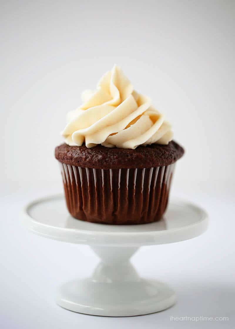 Chocolate cupcake with classic buttercream on a cupcake stand.