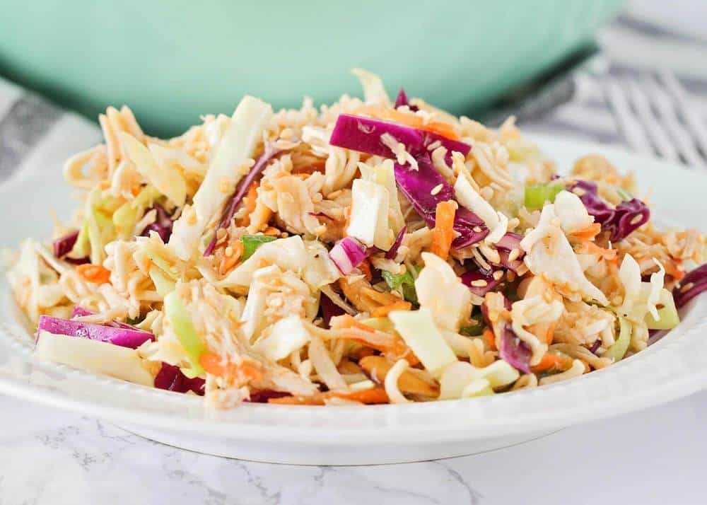 Ramen noodle cabbage salad on a white plate.