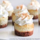 close up of mini coconut cheesecakes on plate