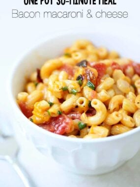bacon and chive macaroni and cheese in a white bowl