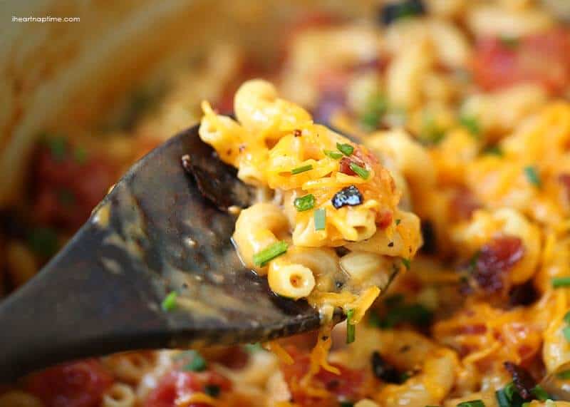 bacon mac and cheese on a wooden spoon 