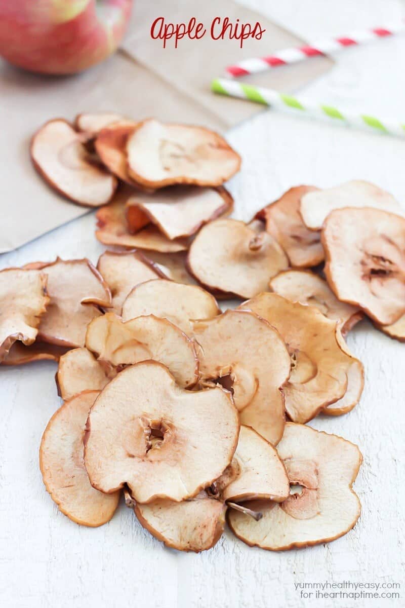 homemade apple chips spread out on a table 