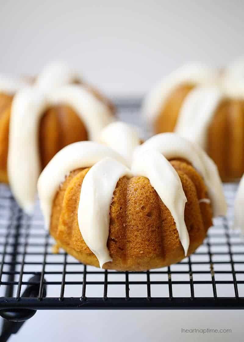 Soft and moist pumpkin bundt cake topped with a rich cream cheese frosting. This easy and delicious cake makes a great fall dessert! mini pumpkin bundt cake with cream cheese frosting