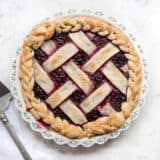 razzleberry pie with lattice crust in a pie dish