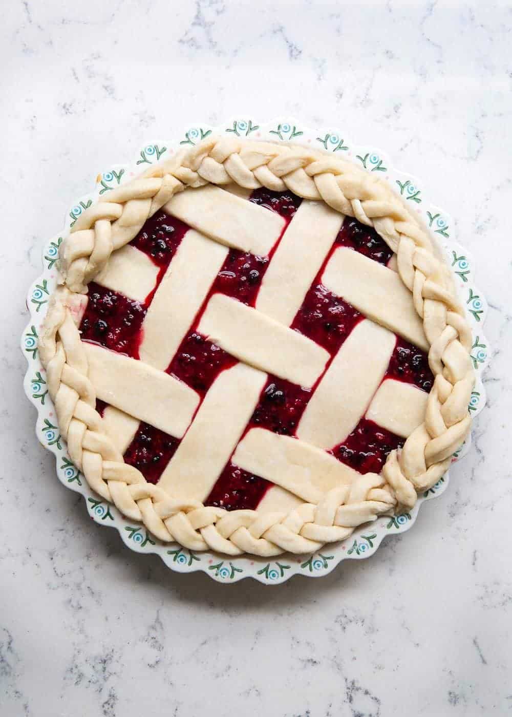 Unbaked razzleberry pie with lattice crust.