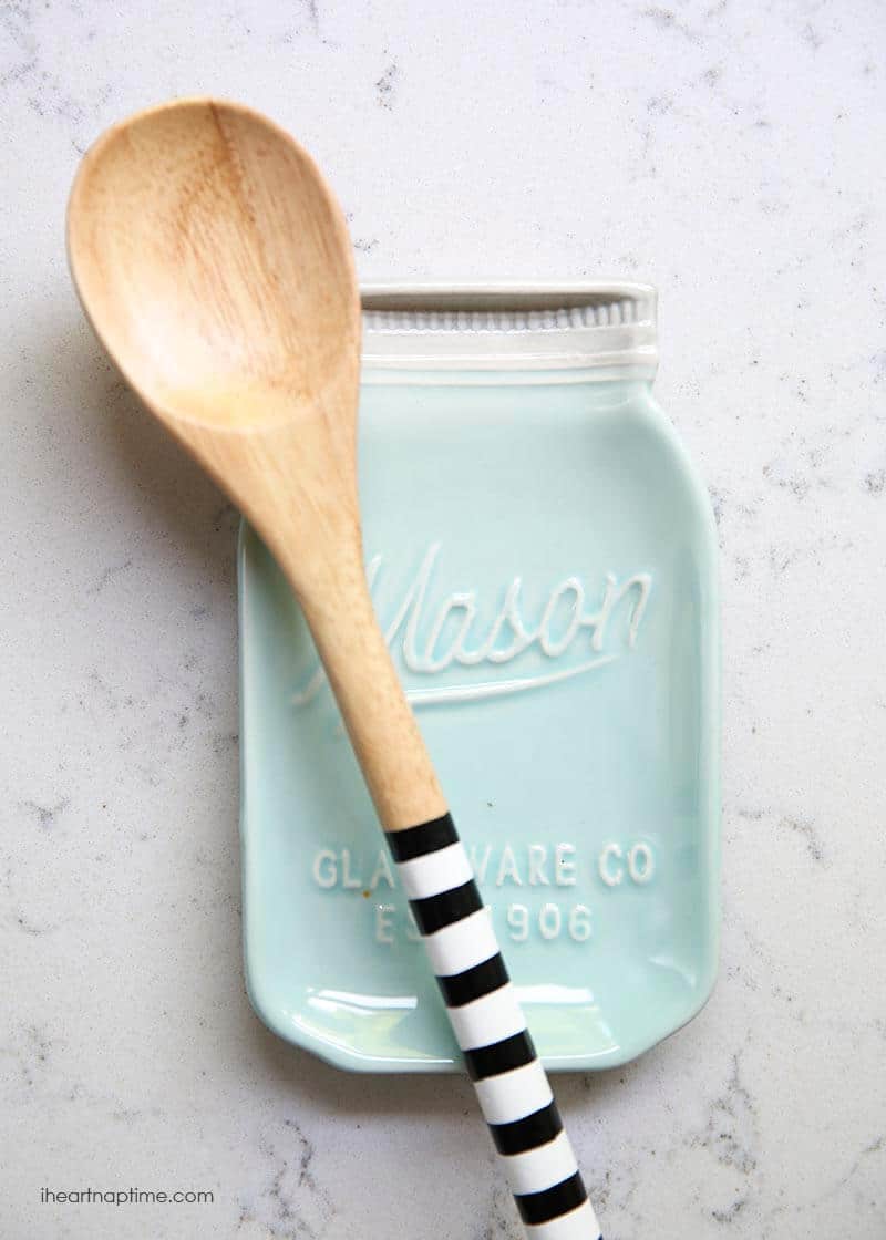 a wooden spoon on a spoon holder 