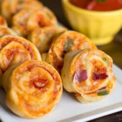 A close up of pizza pinwheels on a plate