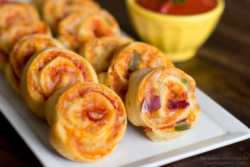 A close up of pizza pinwheels on a plate 