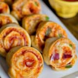 A close up of pizza pinwheels on a plate