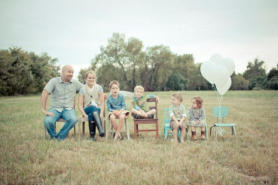 20 Creative Ways to Announce You're Pregnant...inspiration to help you celebrate your growing family. Clever ideas that friends and family will love! Family Photo in chairs