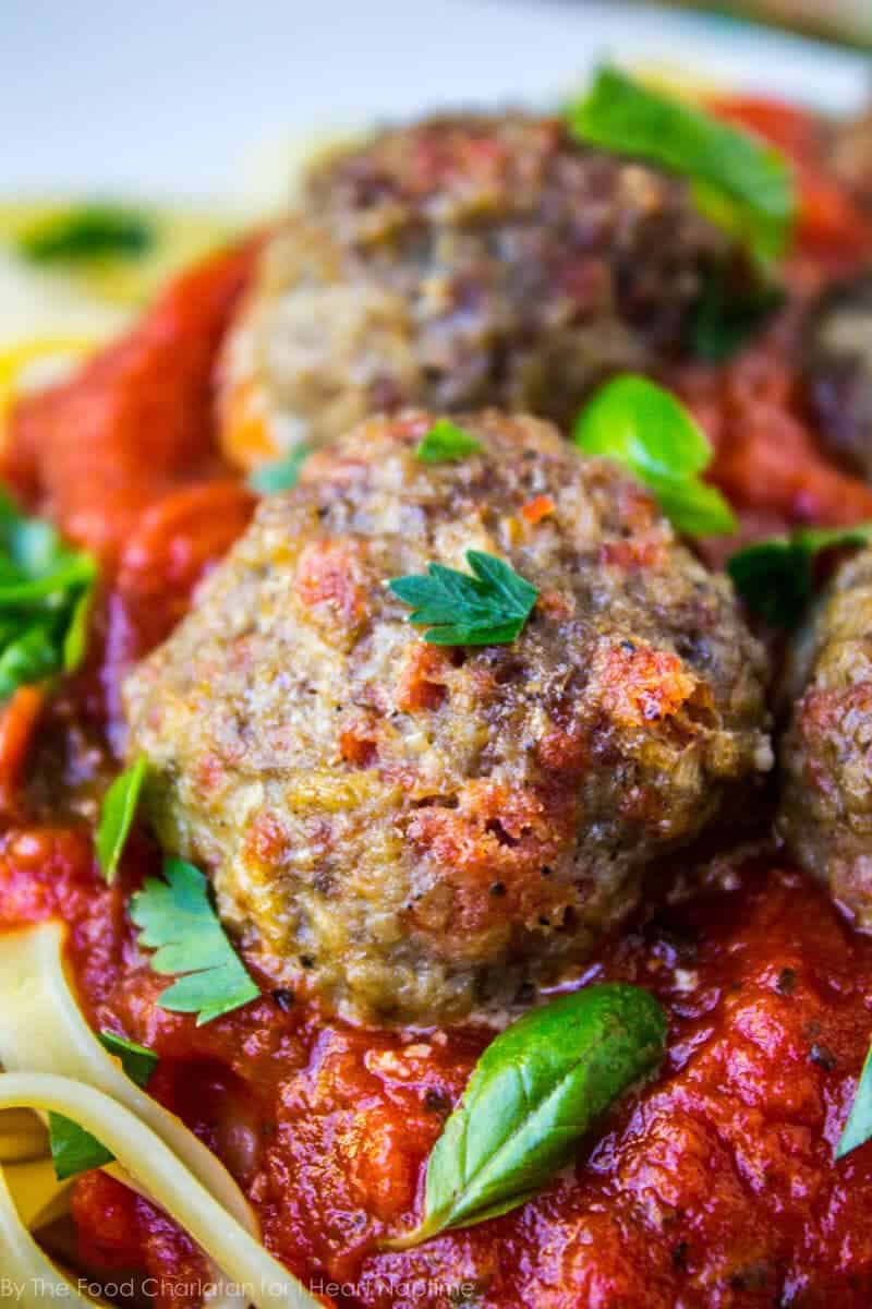 Pepperoni meatballs with pasta, marinara sauce, and fresh basil.