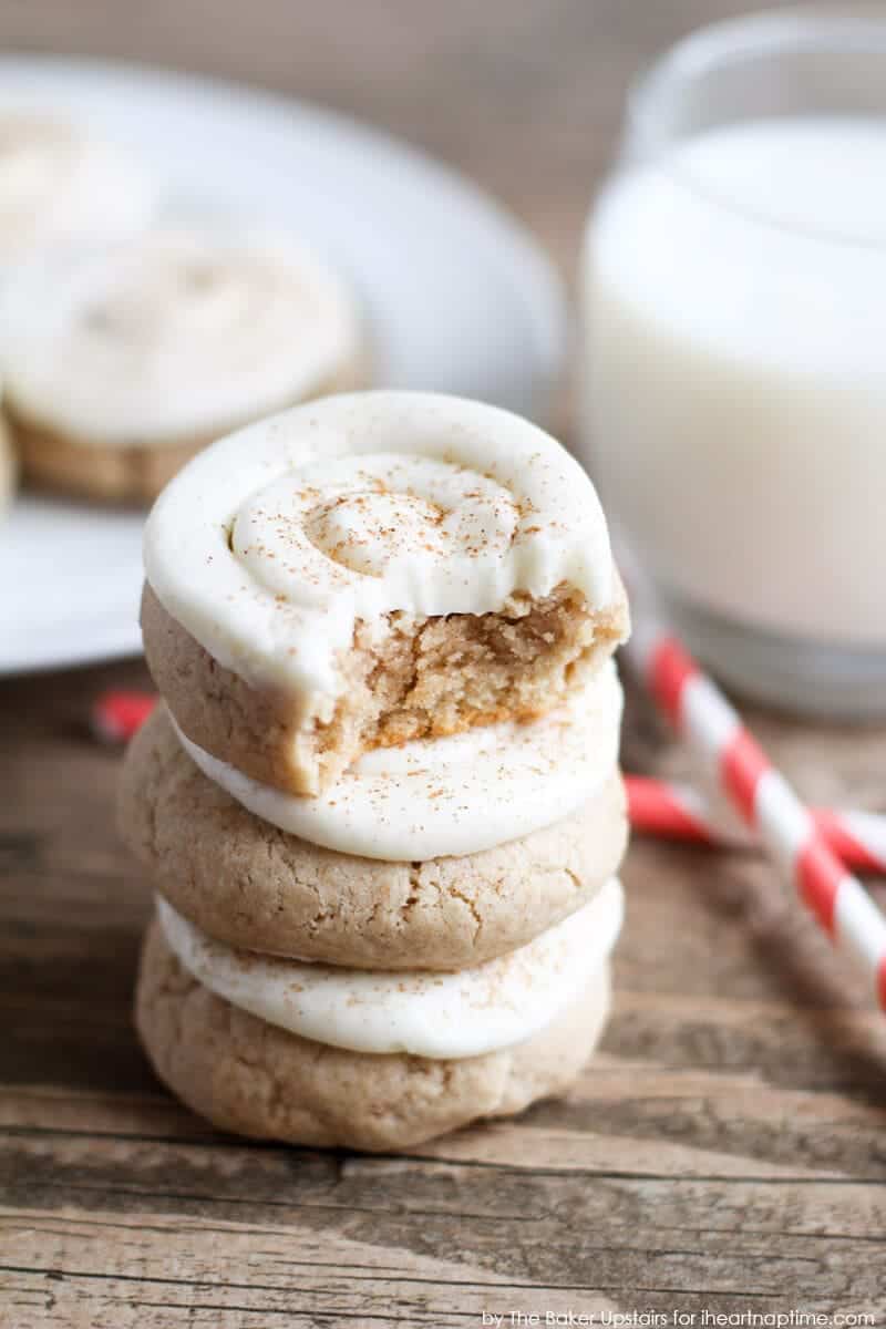Stack of cinnamon roll sugar cookies with a bite taken out.