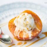 baked peach with ice cream and caramel sauce