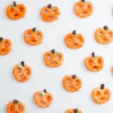 chocolate covered pretzel pumpkins on table